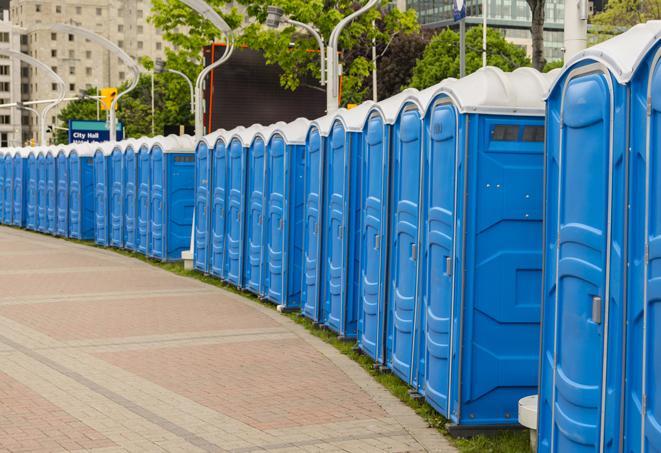 a line of brightly-colored portable restrooms, perfect for outdoor festivals and concerts in Easton, KS